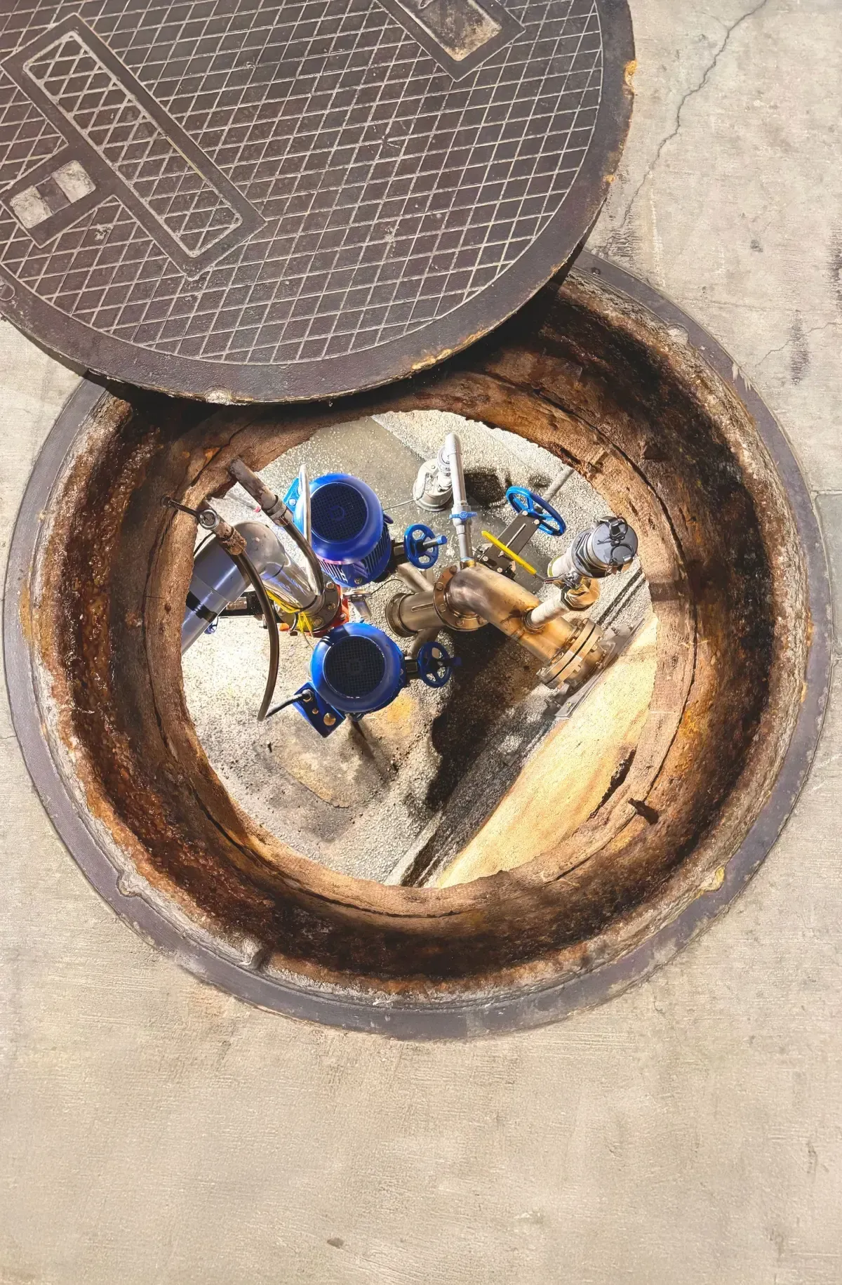 After: OverWatch direct in-line system installed below the same manhole