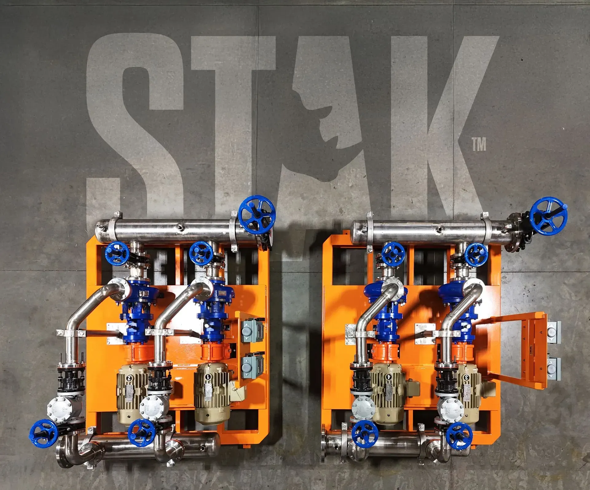 Two RhinoStak pump skids on orange frames, viewed from above