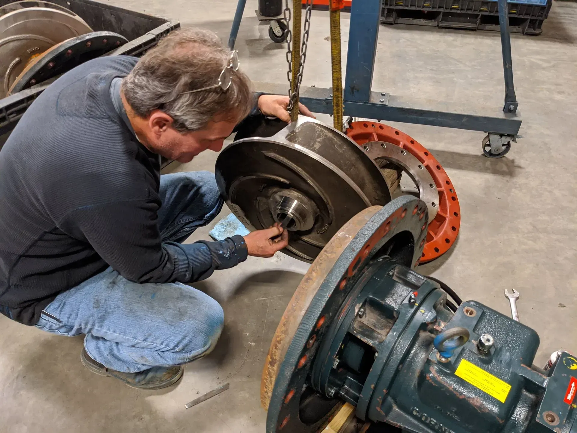 Rhino Pumps technician servicing a large pump in the shop