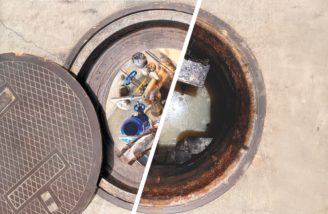 Open manhole showing water and pipes beside a closed manhole cover