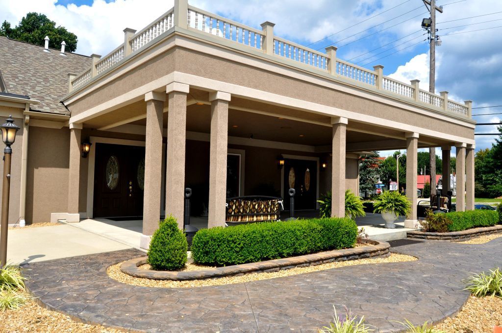 A large building with a large porch and columns