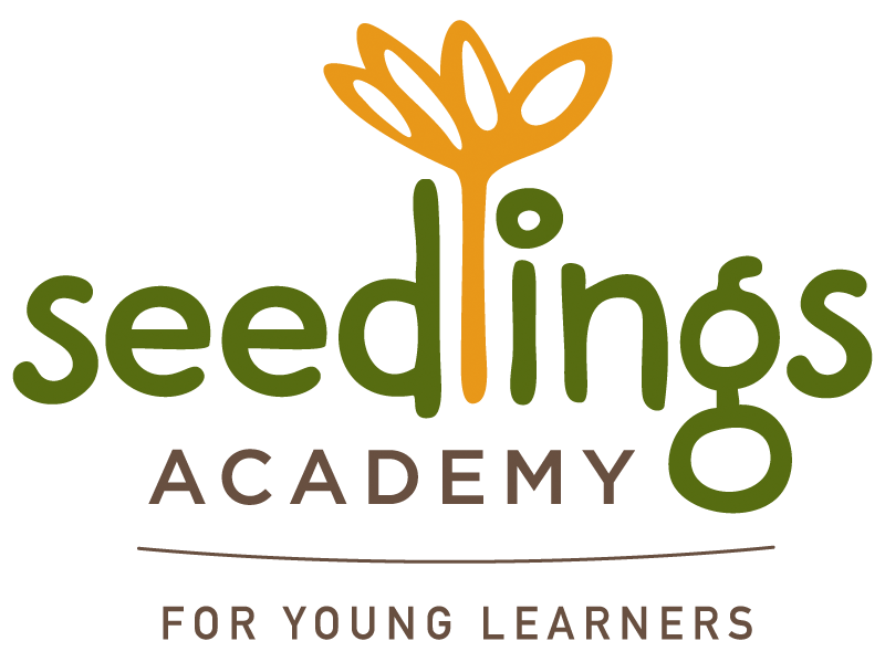Seedlings Academy logo with green and orange plant icon and the words “For Young Learners”