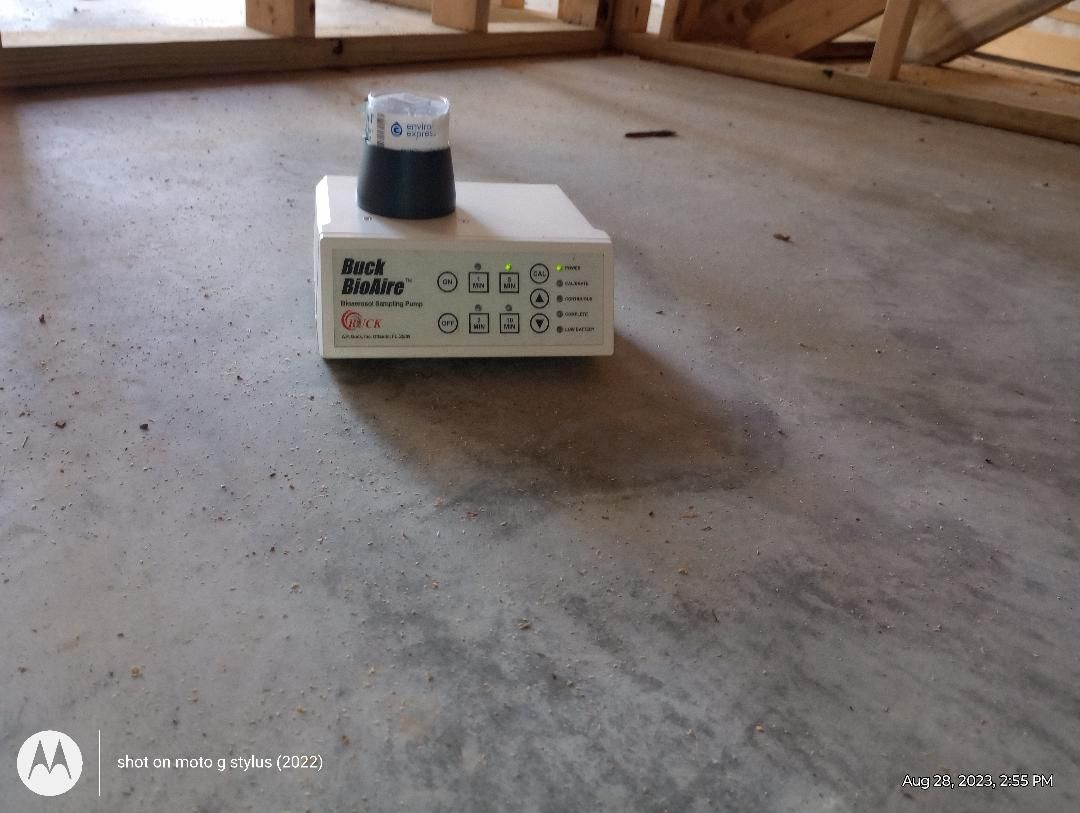 A black and decker box is sitting on a concrete floor