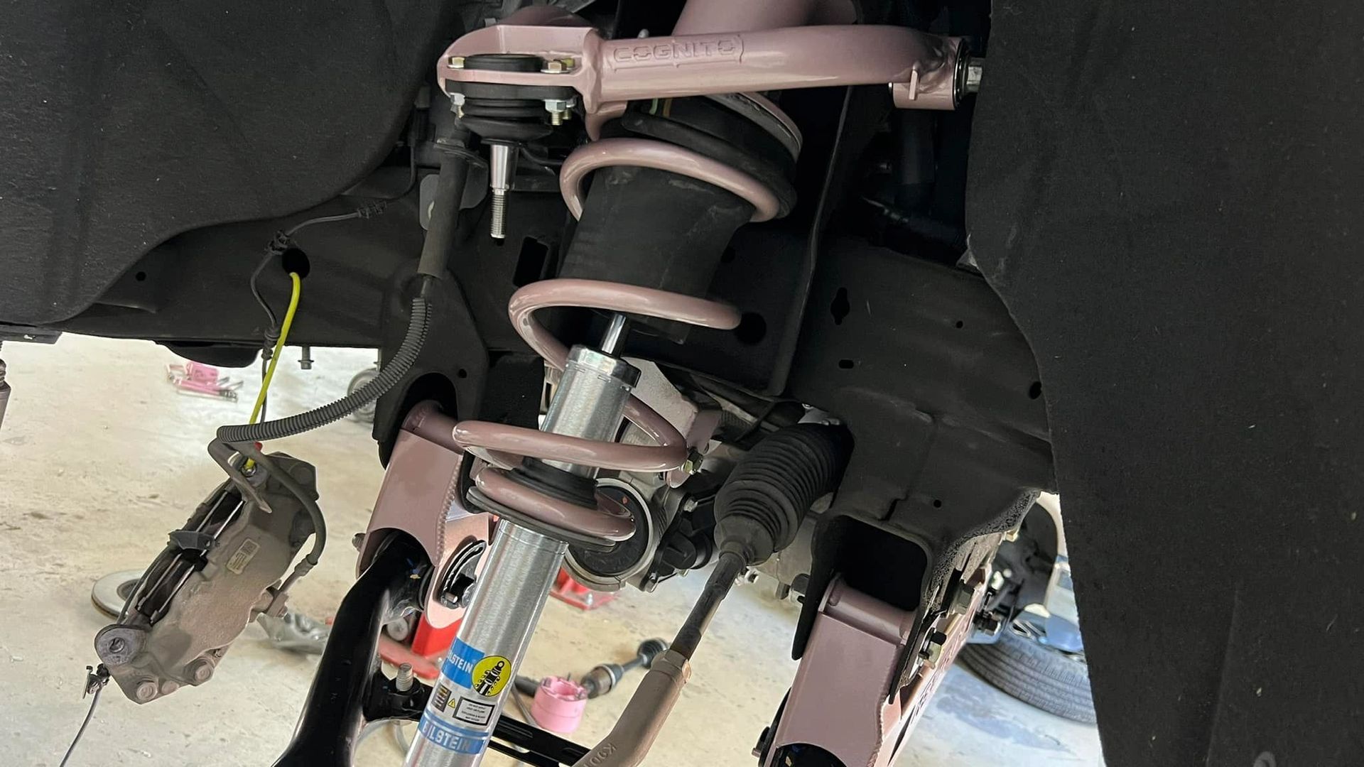 A close up of a shock absorber on a car.