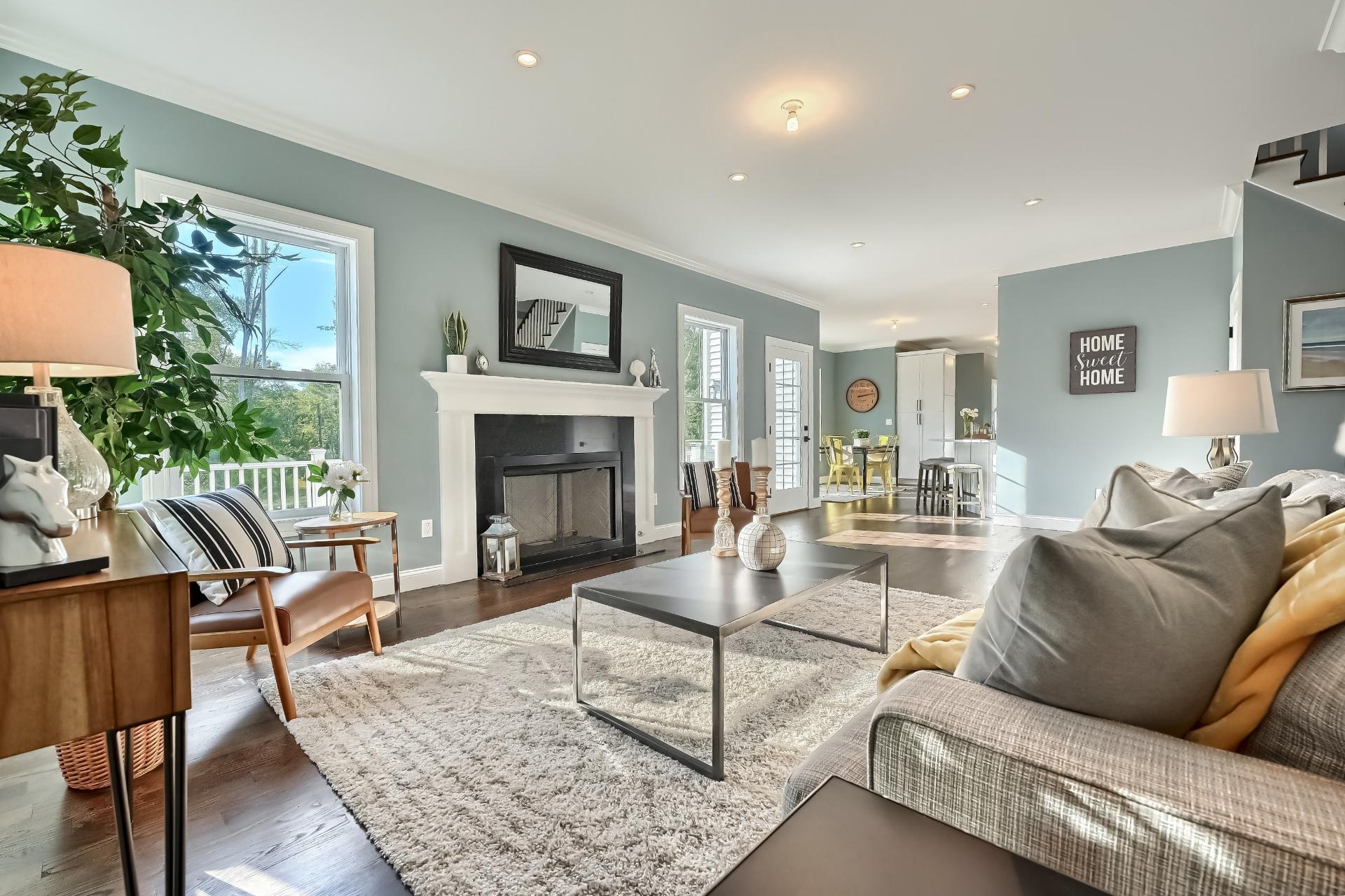 A living room filled with furniture and a fireplace