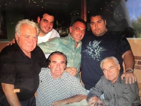 A group of men are posing for a picture together