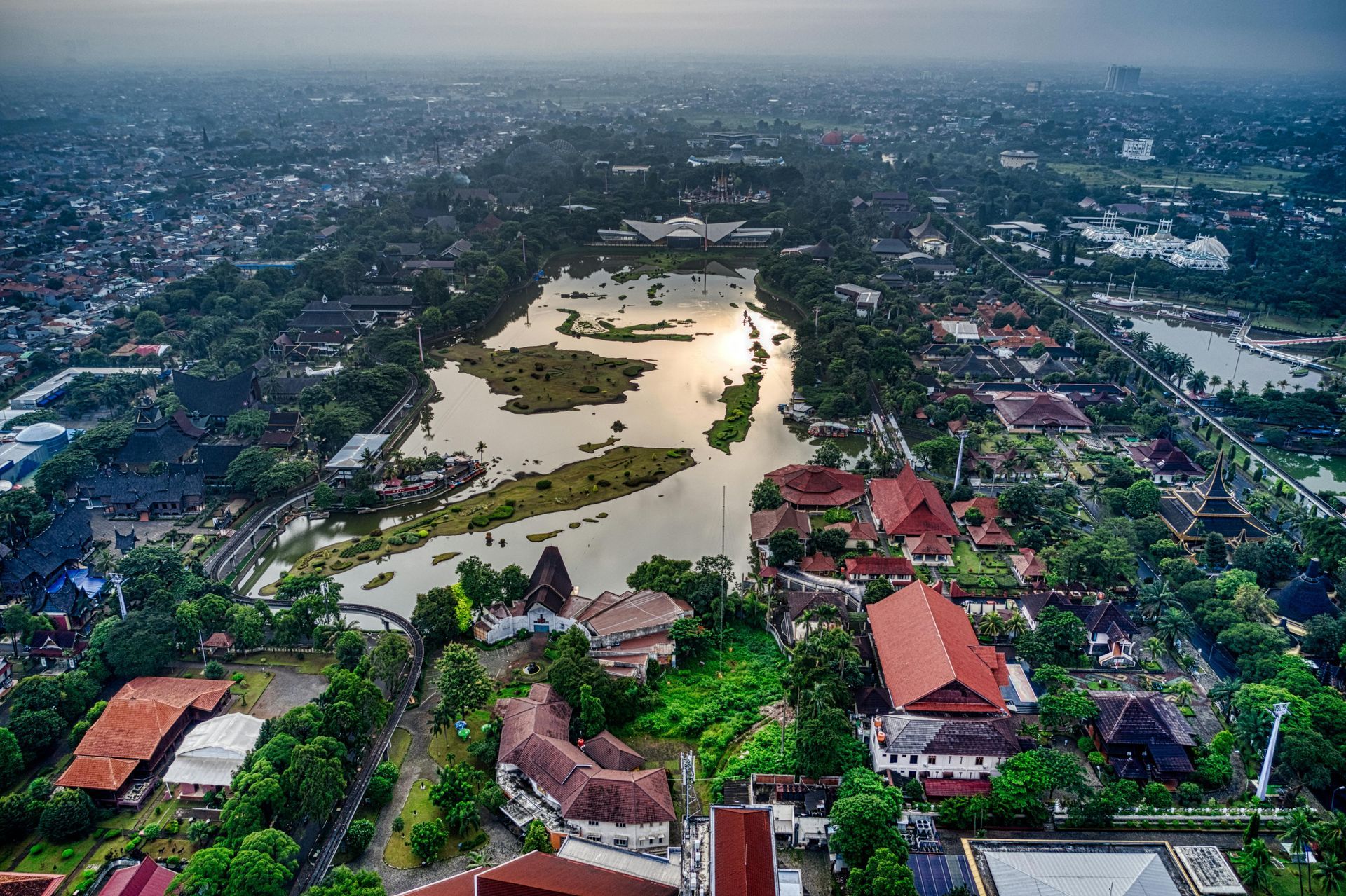Aerial view of buildings amidst an urban forest