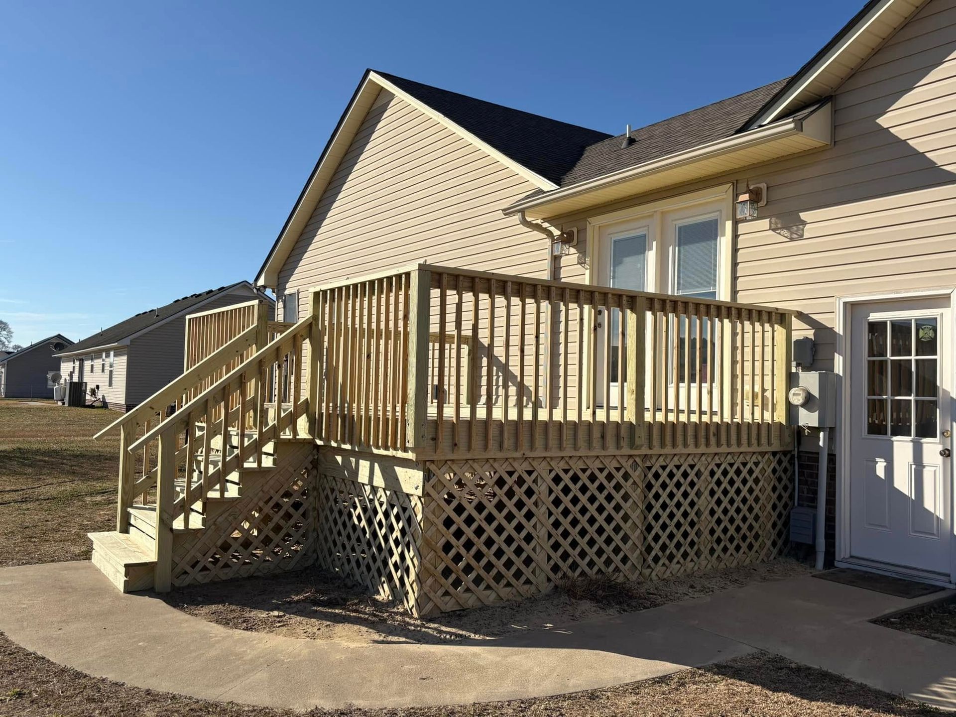 A house with a wooden deck and stairs
