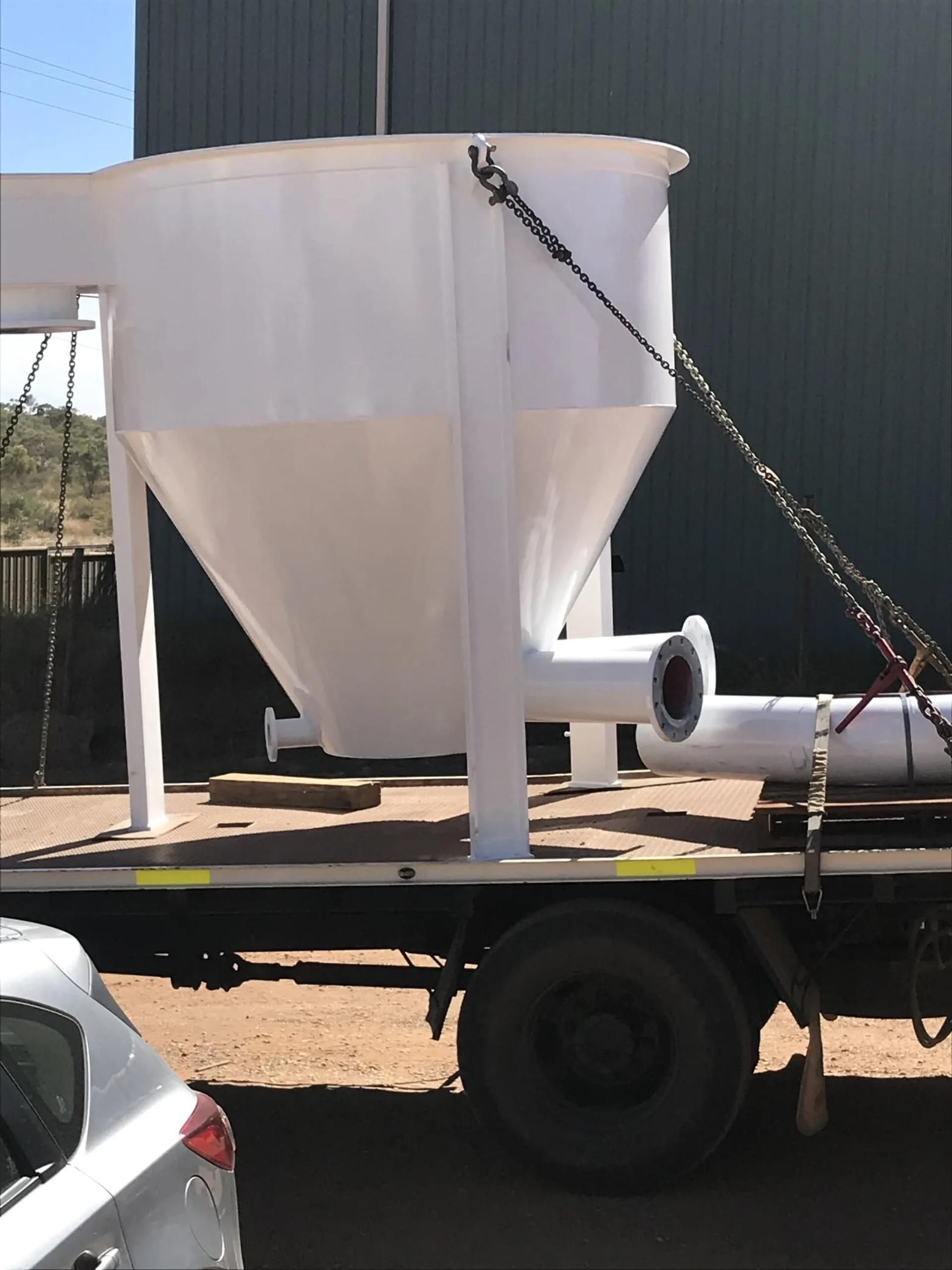 A Large White Container Is On The Back Of A Truck — HardRok Engineering Pty Ltd In Mount Isa, QLD
