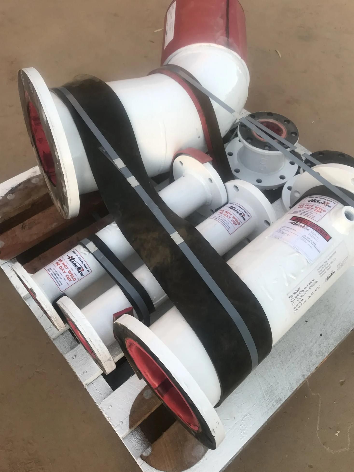 A Bunch Of Pipes Are Stacked On Top Of Each Other — HardRok Engineering Pty Ltd In Mount Isa, QLD