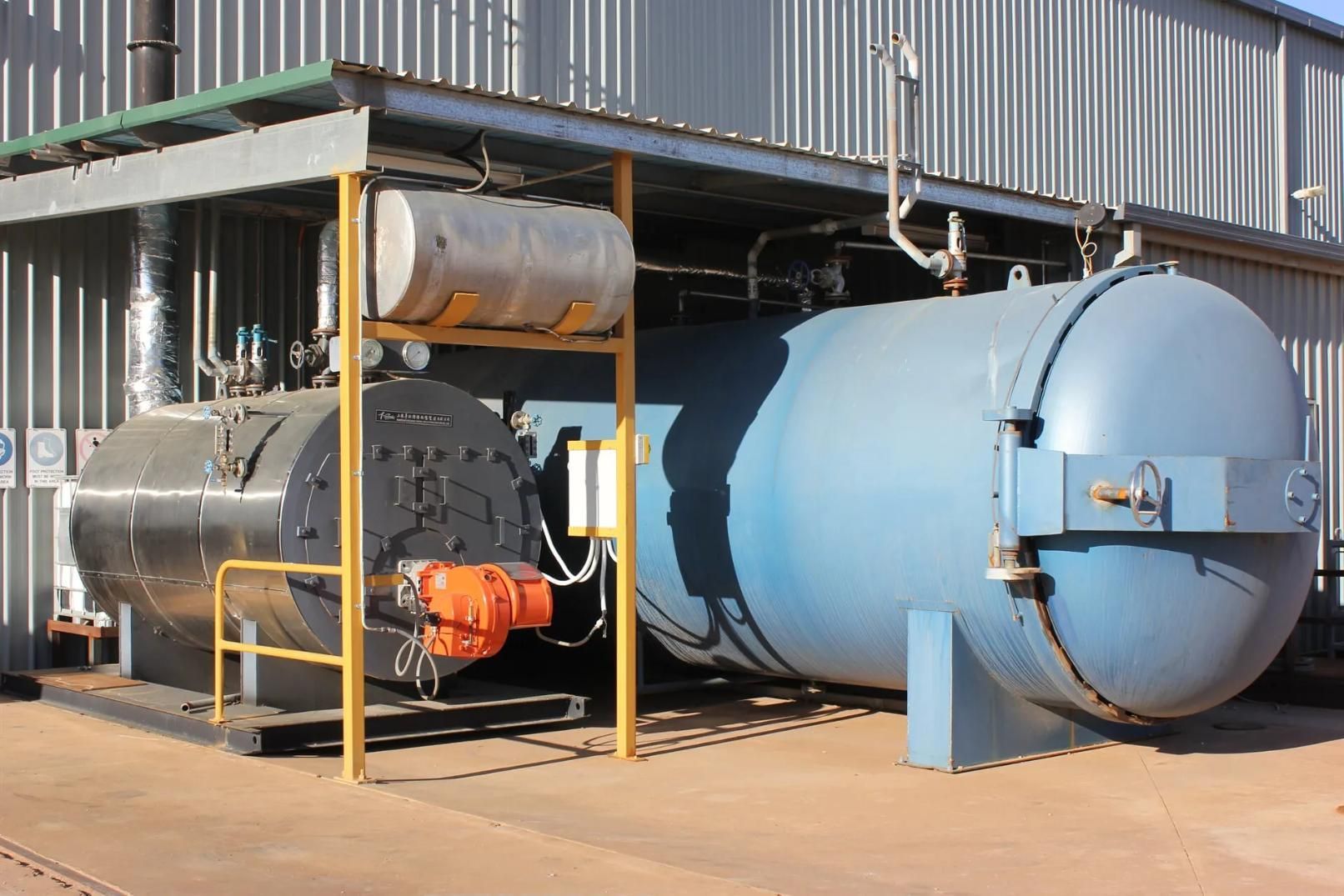 A Large Blue Tank Is Sitting Outside Of A Building — HardRok Engineering Pty Ltd In Mount Isa, QLD