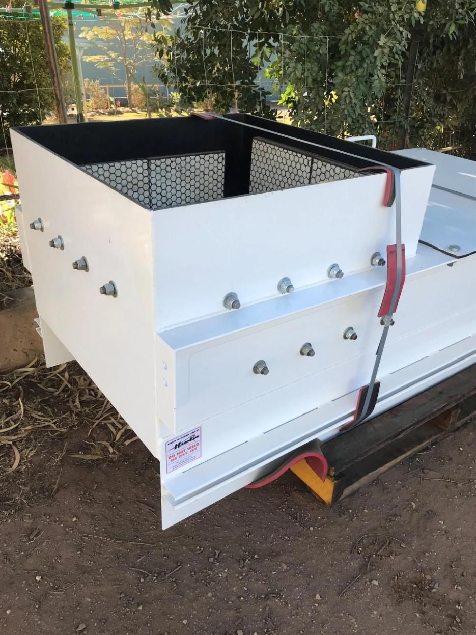 A Large White Box Is Sitting On Top Of A Dirt Field — HardRok Engineering Pty Ltd In Mount Isa, QLD