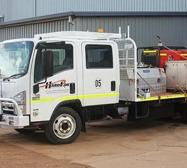 A White Truck Is Parked In Front Of A Building — HardRok Engineering Pty Ltd In Mount Isa, QLD