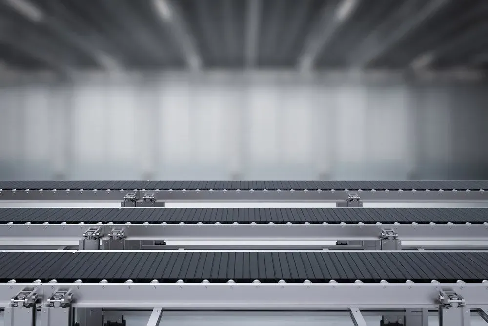 A Conveyor Belt Is Moving Through A Warehouse — HardRok Engineering Pty Ltd In Mount Isa, QLD