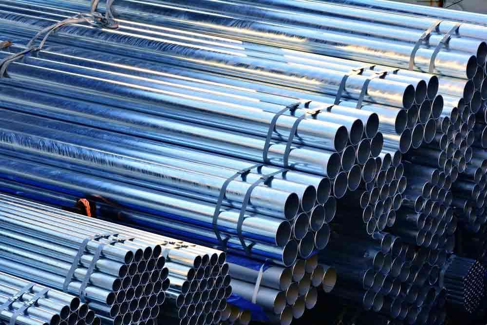 A Pile Of Metal Pipes Stacked On Top Of Each Other — HardRok Engineering Pty Ltd In Mount Isa, QLD
