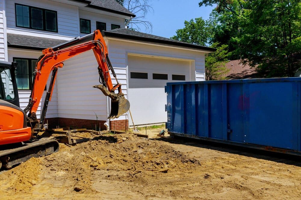 A worksite excavator being operated on soil