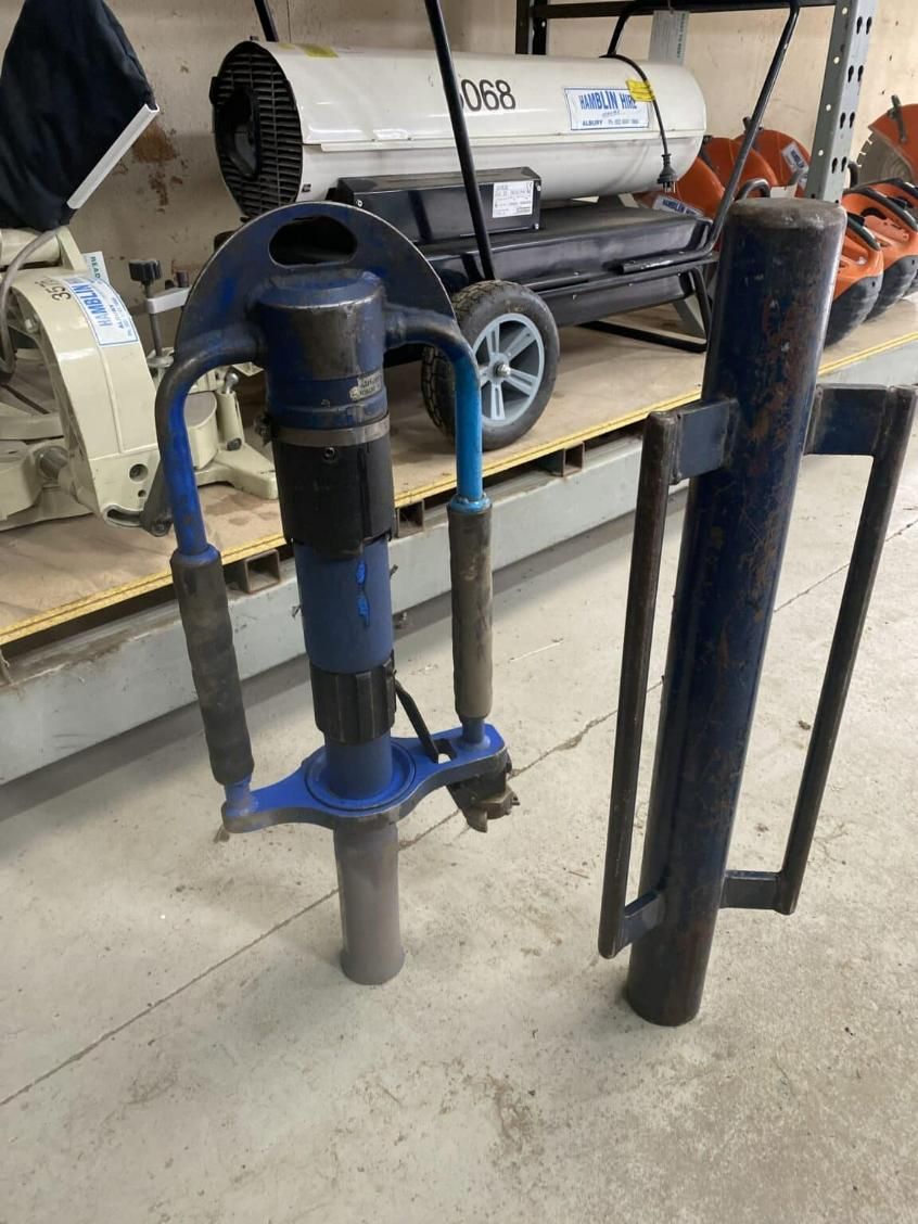 A Machine is Sitting on the Floor Next to a Heater — Hamblin Hire in Albury, NSW