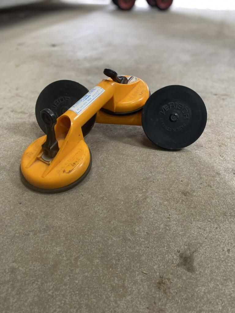 A Yellow Toy Car is Sitting on a Concrete Floor — Hamblin Hire in Albury, NSW