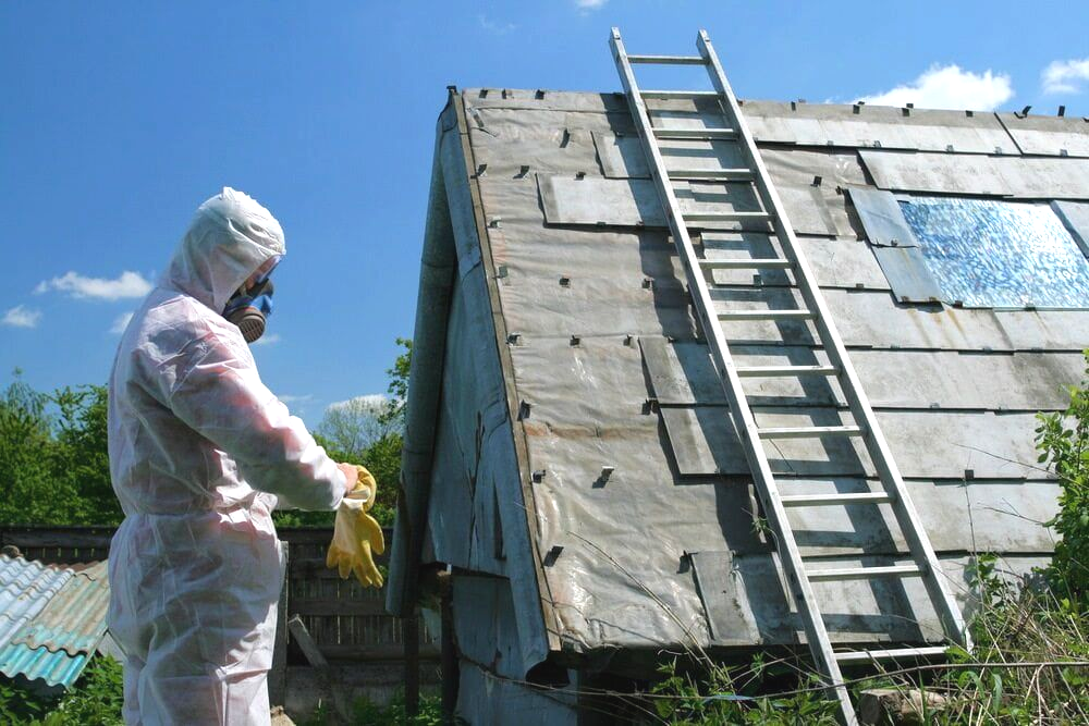 Person in Hazmat Suit Near a Dilapidated Roof, With a Ladder — Dirt Werx in Southern Highlands, NSW