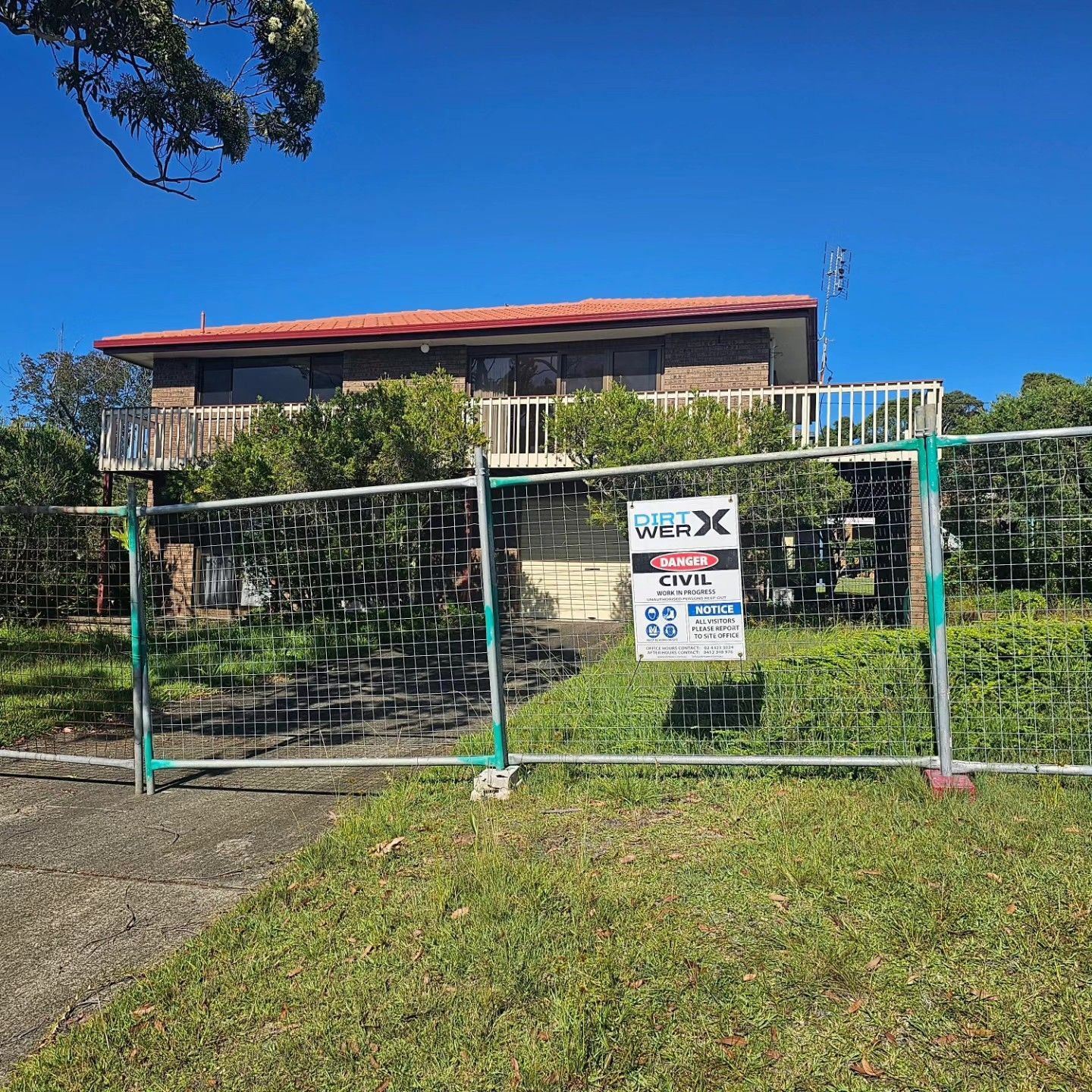 Rural House Behind Green Chain Fence Ready For Demolition — Dirt Werx in Newcastle, NSW