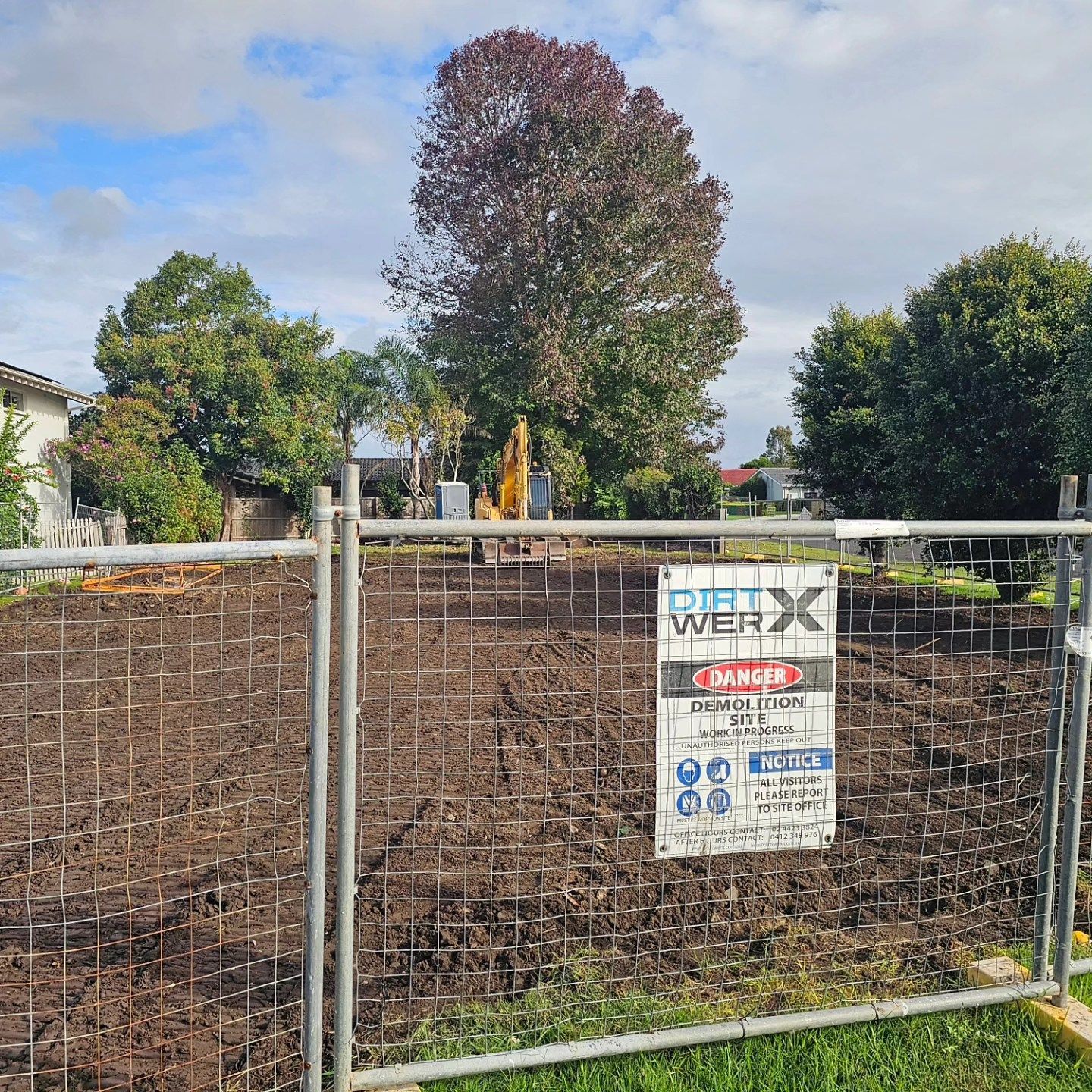 Fenced Vacant Lot With A Sign Undergoing Demolition — Dirt Werx in Maitland, NSW