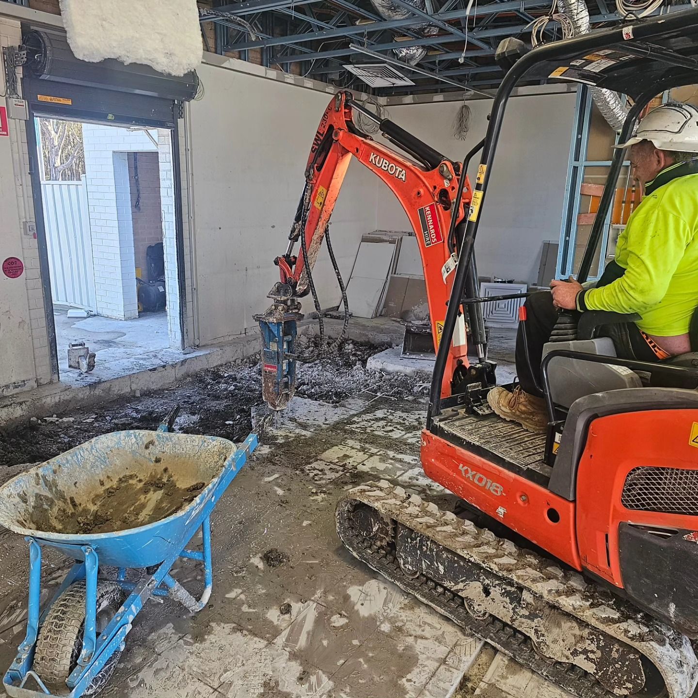 Orange Mini Excavator In A House Doing Demolition Process — Dirt Werx in Port Stephens, NSW