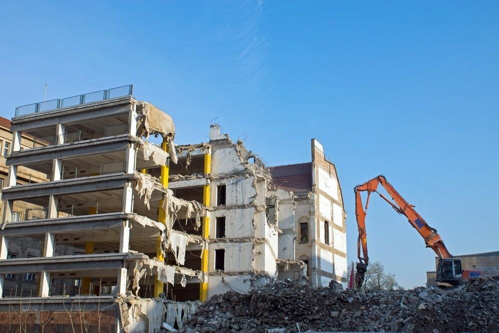 Building Demolition in Progress; Excavator Tearing Down Structure — Dirt Werx in Shellharbour, NSW