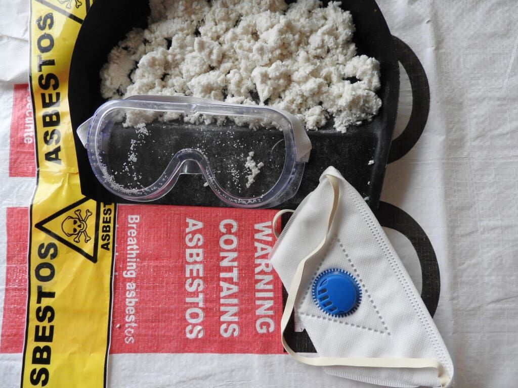 Safety Gear on an Asbestos Warning Bag — Dirt Werx in Nowra, NSW