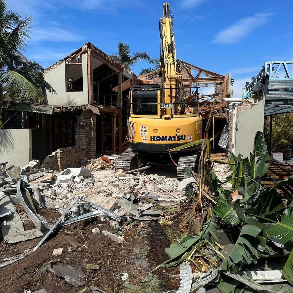 Excavator Demolishing A Damaged House During Demolition In Port Stephens