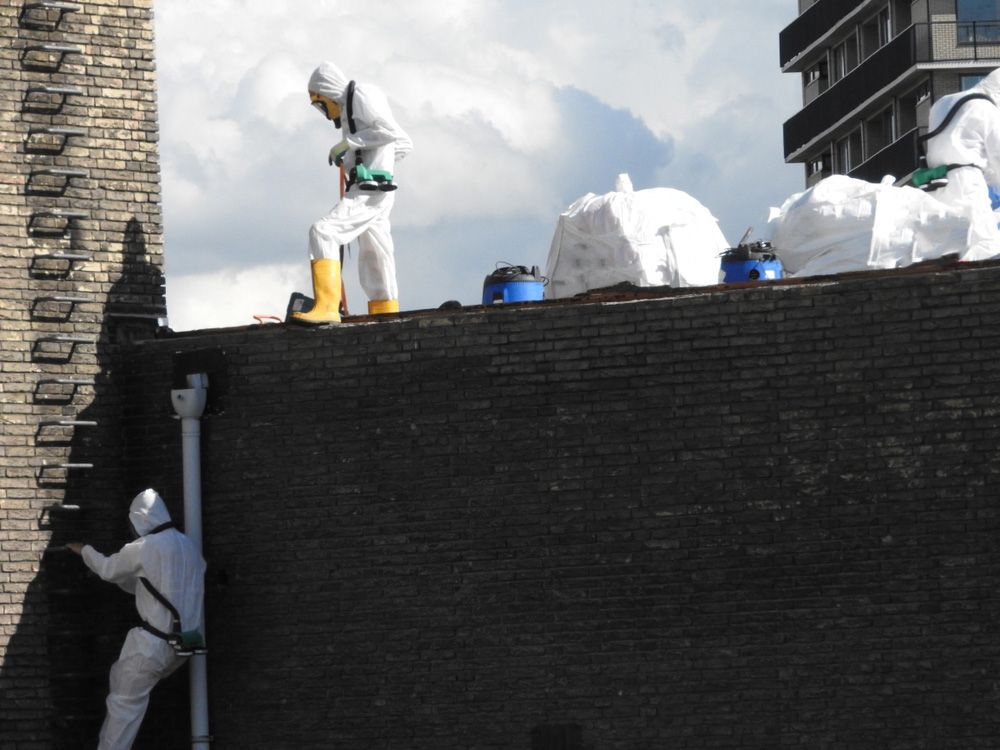 Workers Removing Asbestos on Roof