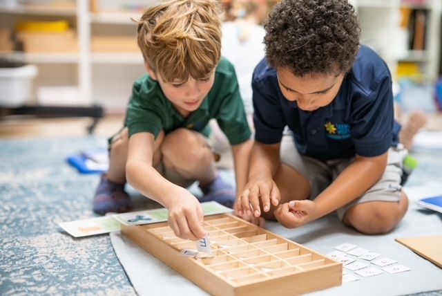montessori children working with language activity