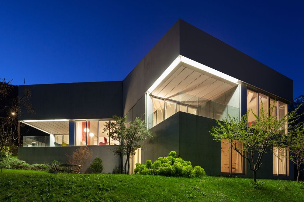 Modern Glass-and-wood House at Night — Gatley Building Design in Gin Gin, QLD