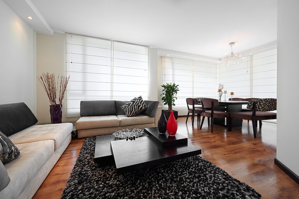 Modern Living Room With Beige and Black Sofas — Gatley Building Design in Coral Cove, QLD