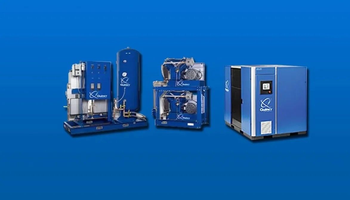 A group of blue air compressors are sitting next to each other on a blue background.