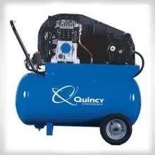 A blue air compressor with wheels and a handle on a white background.