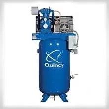A blue air compressor with wheels and a handle on a white background.