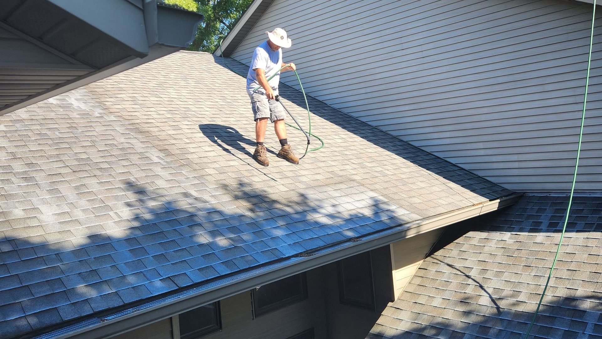 Roof restoration spray being done