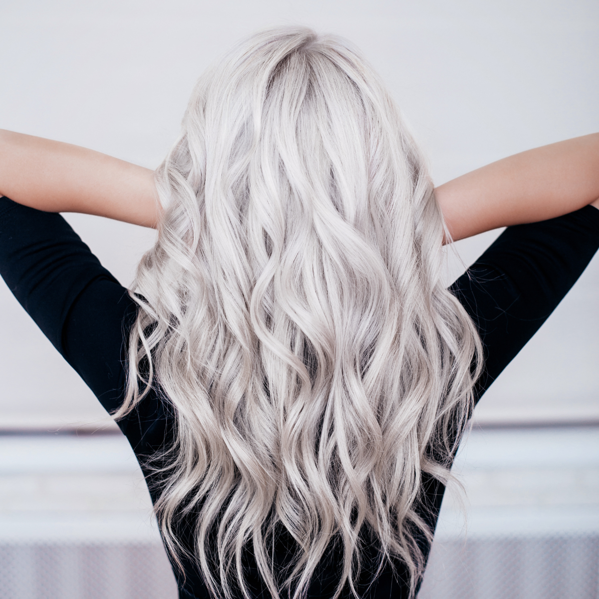 Woman with curly white hair