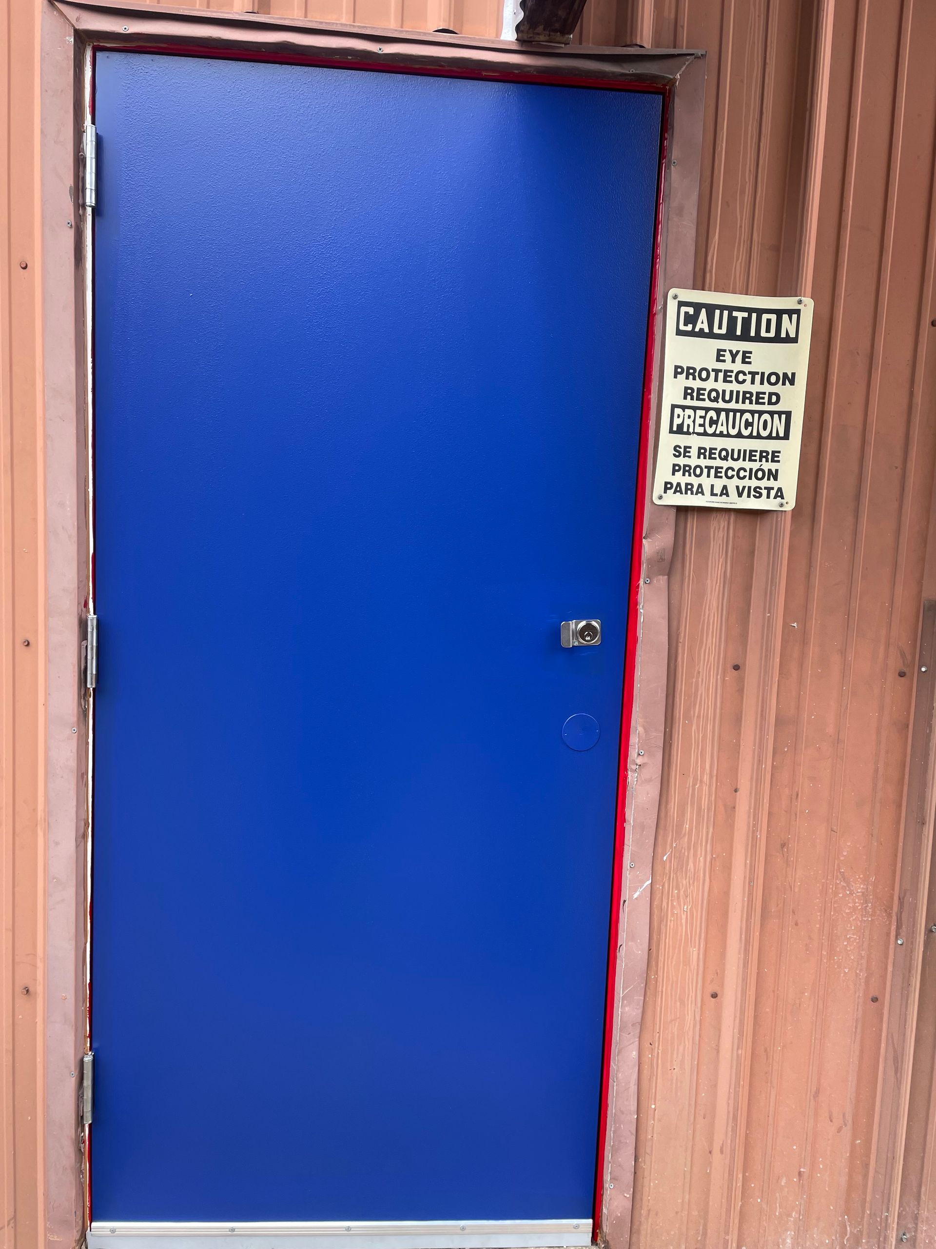 A blue door with a sign that says station on it