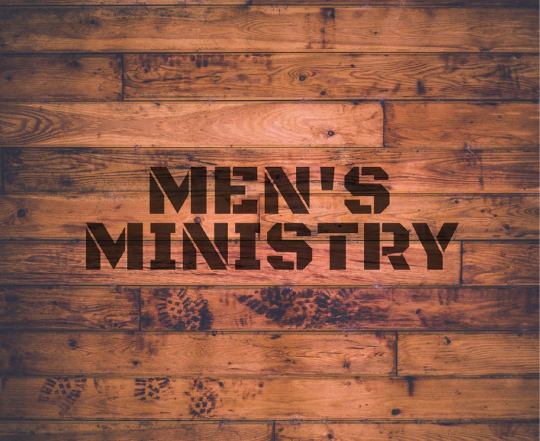 A wooden wall with the words `` men 's ministry '' written on it.