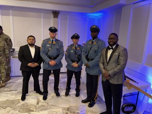 Men in suits and military uniforms standing together Men in suits and military uniforms standing together