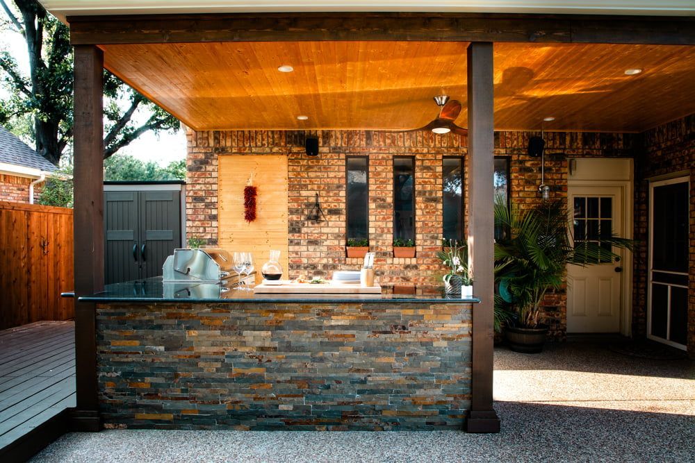Outdoor Kitchen with A Stone Bar — Zero 21 Fit-Outs & Joinery: Kitchen Renovation Gold Coast in Molendinar, QLD