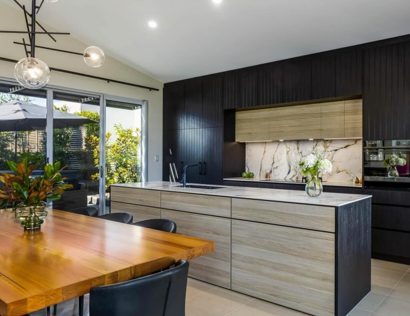 Modern Kitchen with Dark Cabinets — Zero 21 Fit-Outs & Joinery: Kitchen Renovation Gold Coast in Tweed Heads, QLD