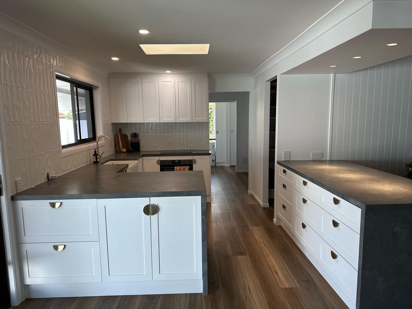 White Kitchen with Gray Countertops — Zero 21 Fit-Outs & Joinery: Kitchen Renovation Gold Coast in Molendinar, QLD