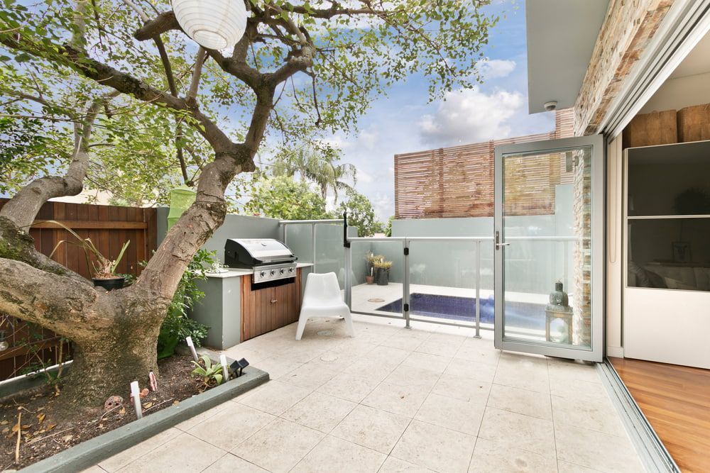 Backyard with A Grill, Small Pool, and A Tree — Zero 21 Fit-Outs & Joinery: Kitchen Renovation Gold Coast in Molendinar, QLD