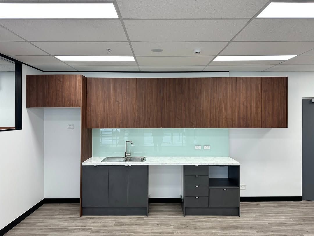 A Small Office Kitchenette: Dark Wood Cabinets — Zero 21 Fit-Outs & Joinery: Kitchen Renovation Gold Coast in Robina, QLD