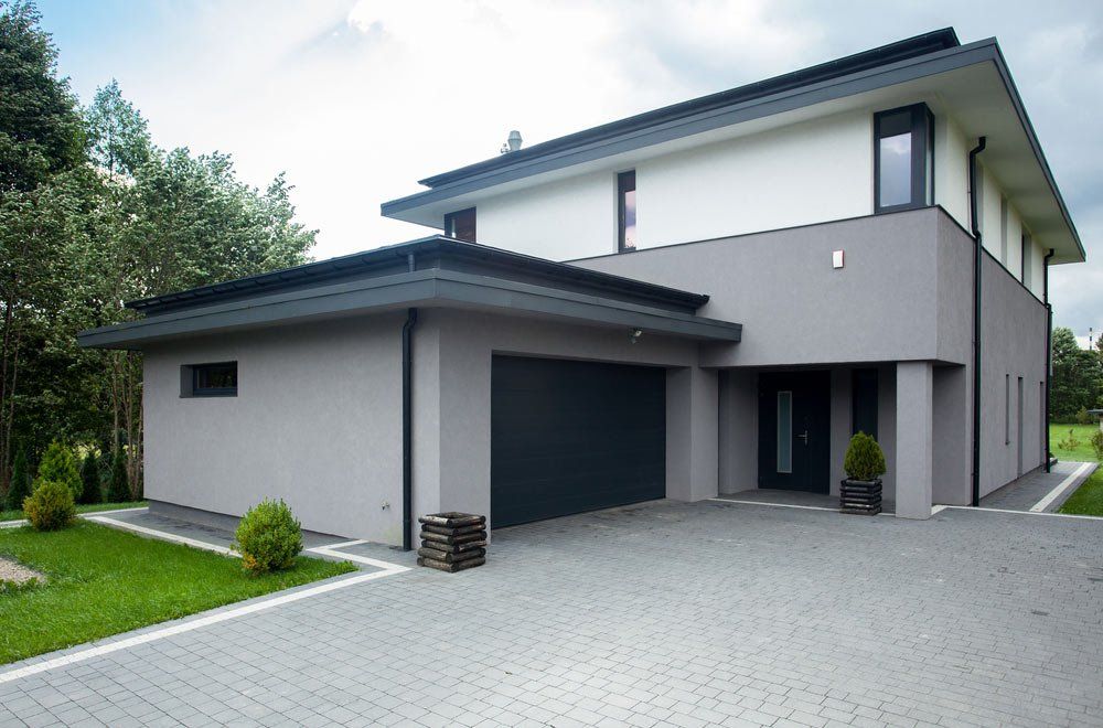 Contemporary Concrete Driveway Parking Of The Big Modern House — Maitland Concreting Specialists In Maitland New South Wales