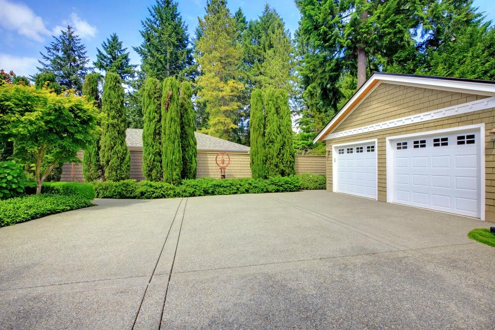 Double Doors Garage With Wide Long Driveway — Maitland Concreting Specialists In Cessnock NSW