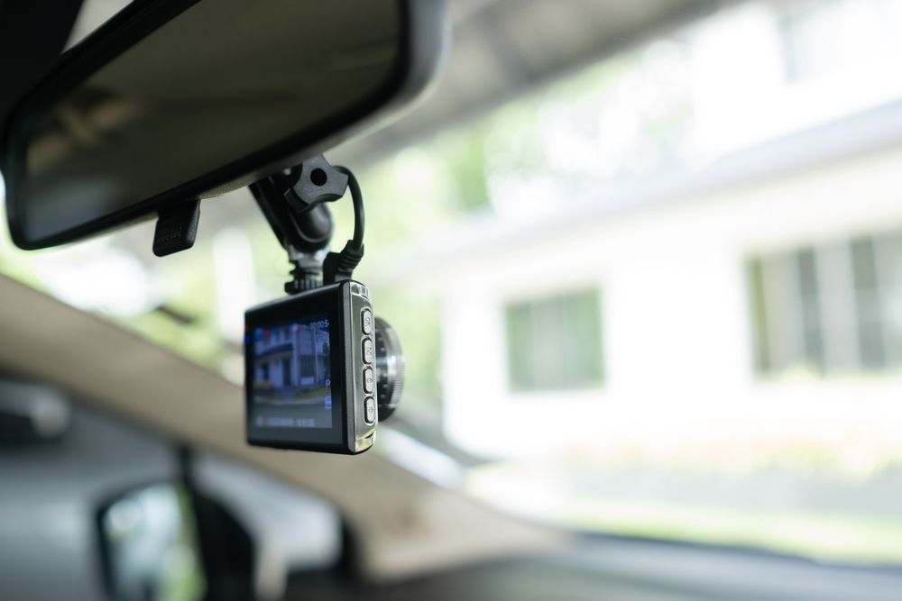 Dashcam Mounted on Rearview Mirror in Car — Mullumbimby Auto Electrical in Mullumbimby, NSW