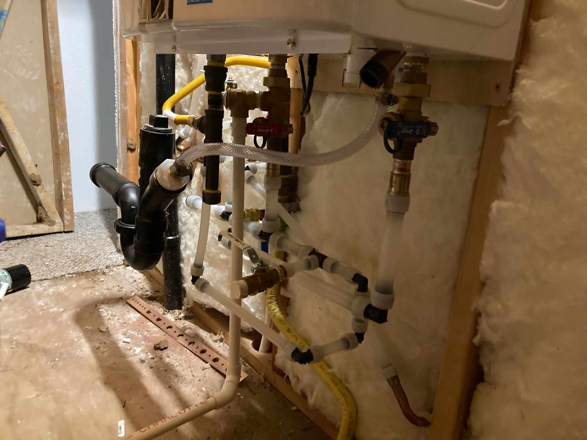 a water heater is being installed in a basement .